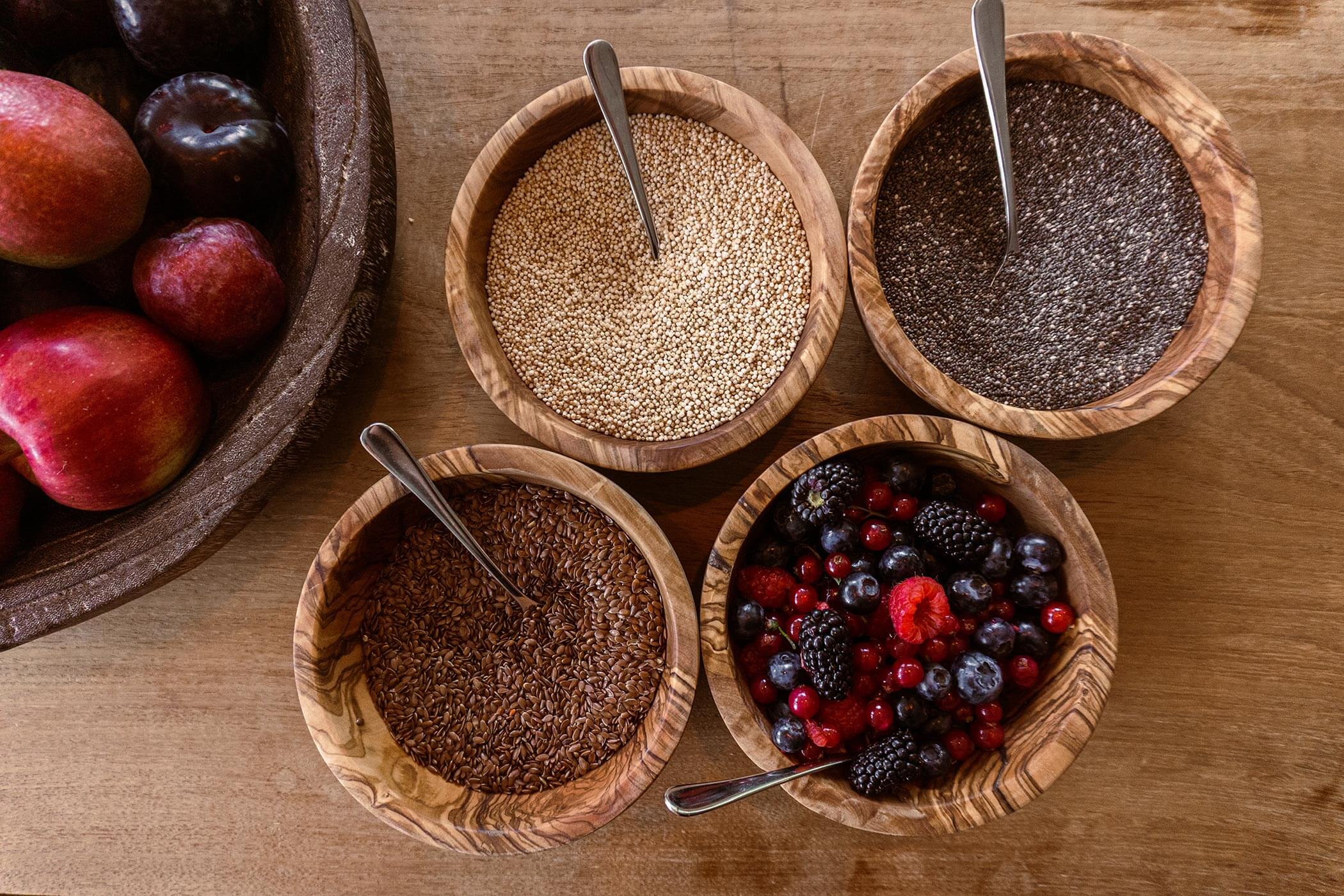 Various toppings and berries in small bowls 