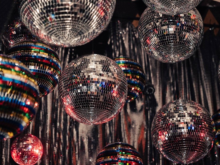 Different sized disco balls and many bright colours