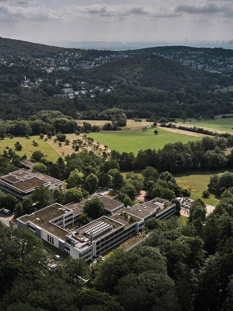Birds-eye view of Bold Campus and its surroundings with dense forests in the front